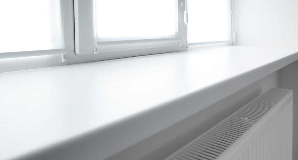 Modern white plastic window sill